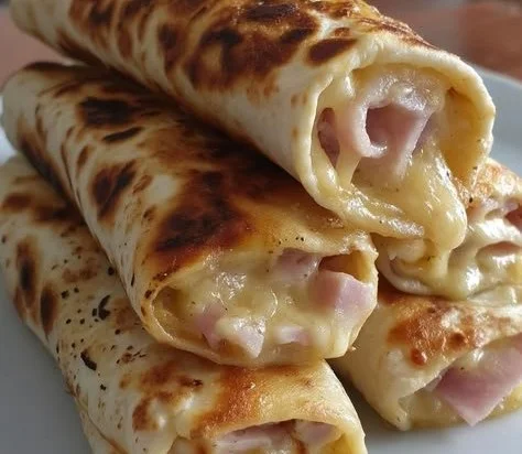 Air fryer hot chicken ham and cheese wraps served on a plate