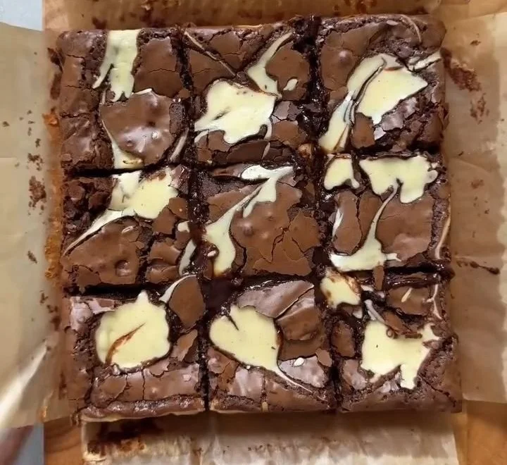 Fudgy cheesecake brownie topped with chocolate and cream cheese swirl