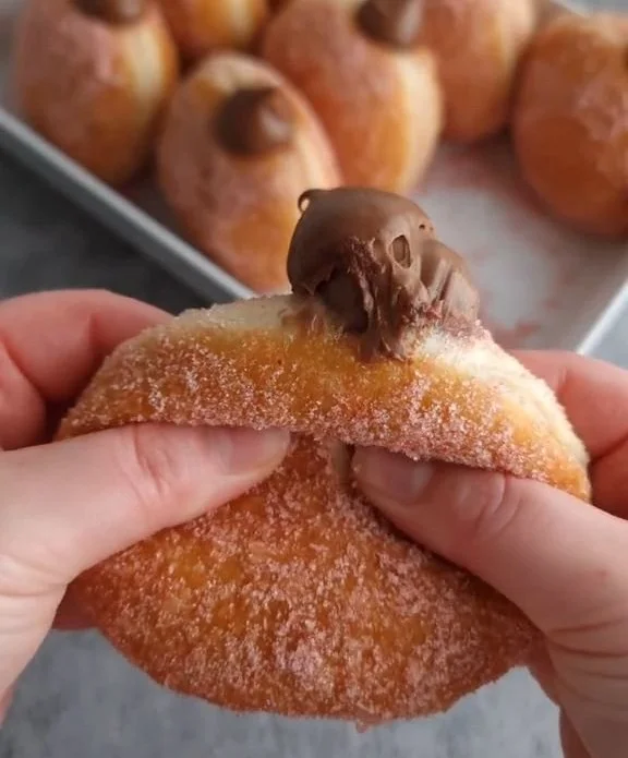 Delicious Hazelnut Cream Beignets dusted with powdered sugar