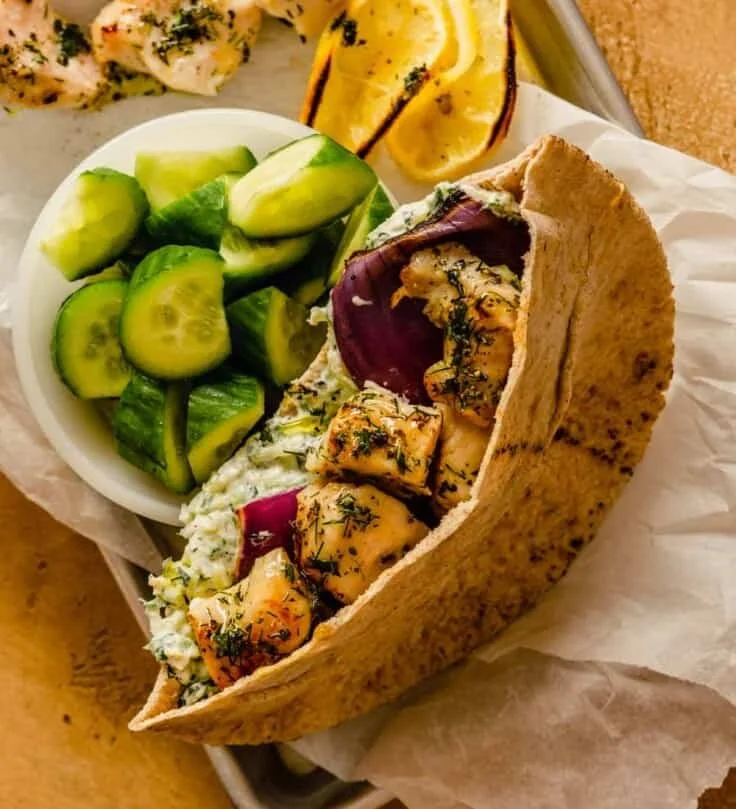 Healthy grilled chicken served on a plate with fresh vegetables