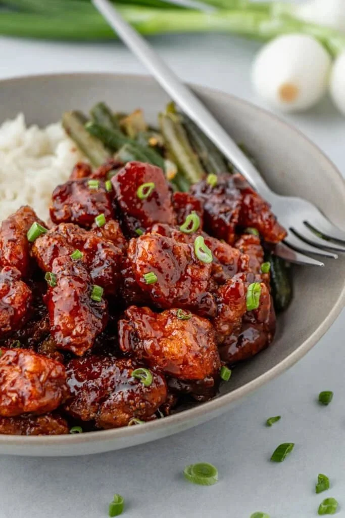Delicious Honey Butter Chicken served with a side of crispy fries