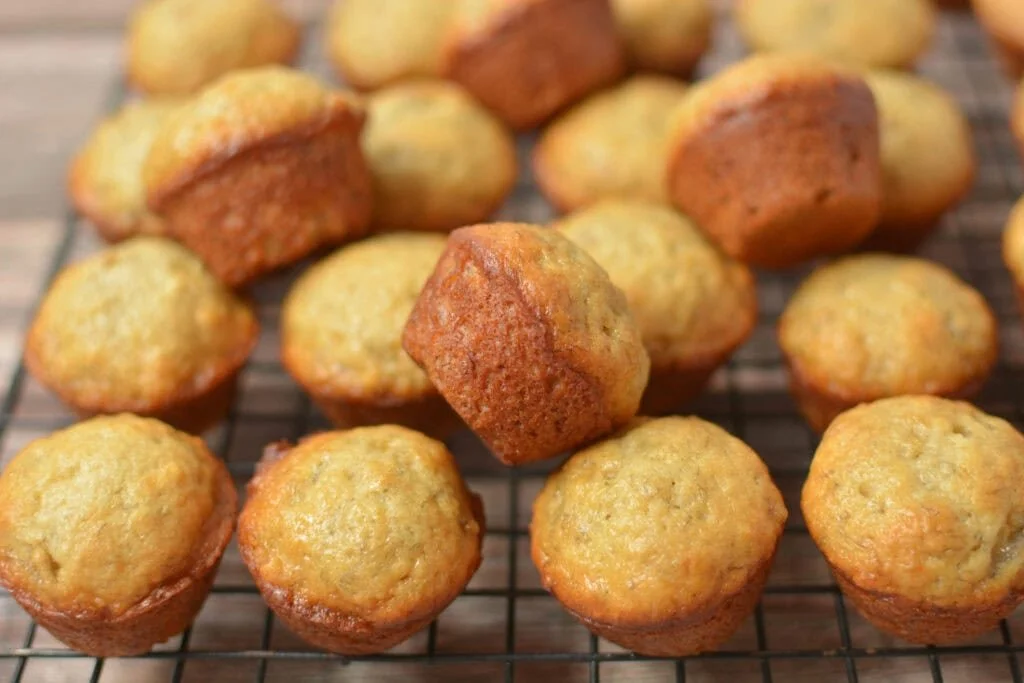 Delicious mini banana muffins on a plate, fresh out of the oven