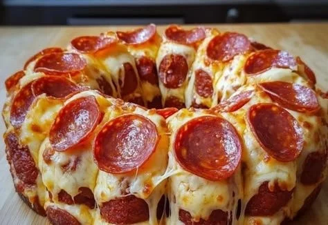 Delicious Pepperoni Pizza Monkey Bread topped with melted cheese and pepperoni slices.
