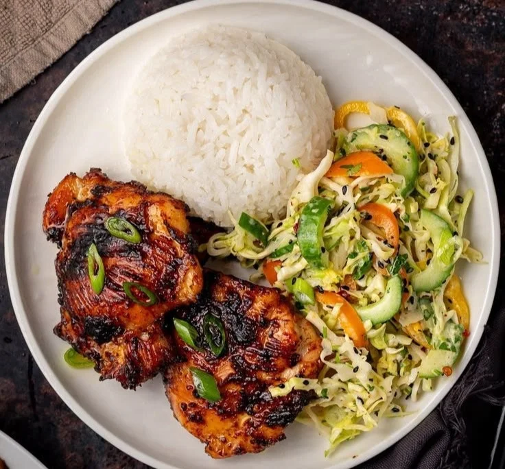 Delicious roasted miso chicken thighs with vibrant garnish on a plate