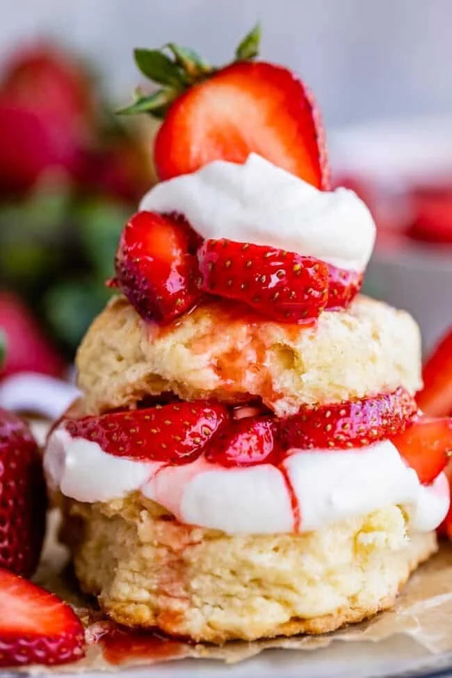 Delicious strawberry shortcake topped with fresh strawberries and whipped cream
