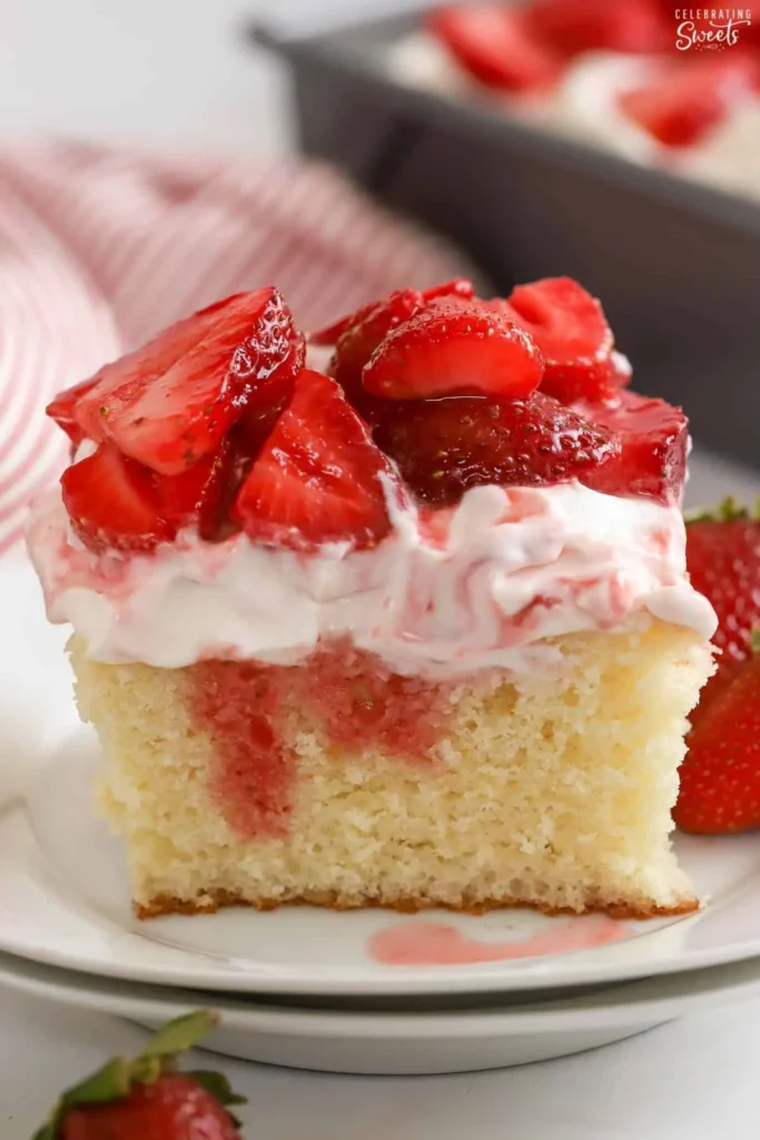 Delicious strawberry shortcake sheet cake with fresh strawberries and whipped cream