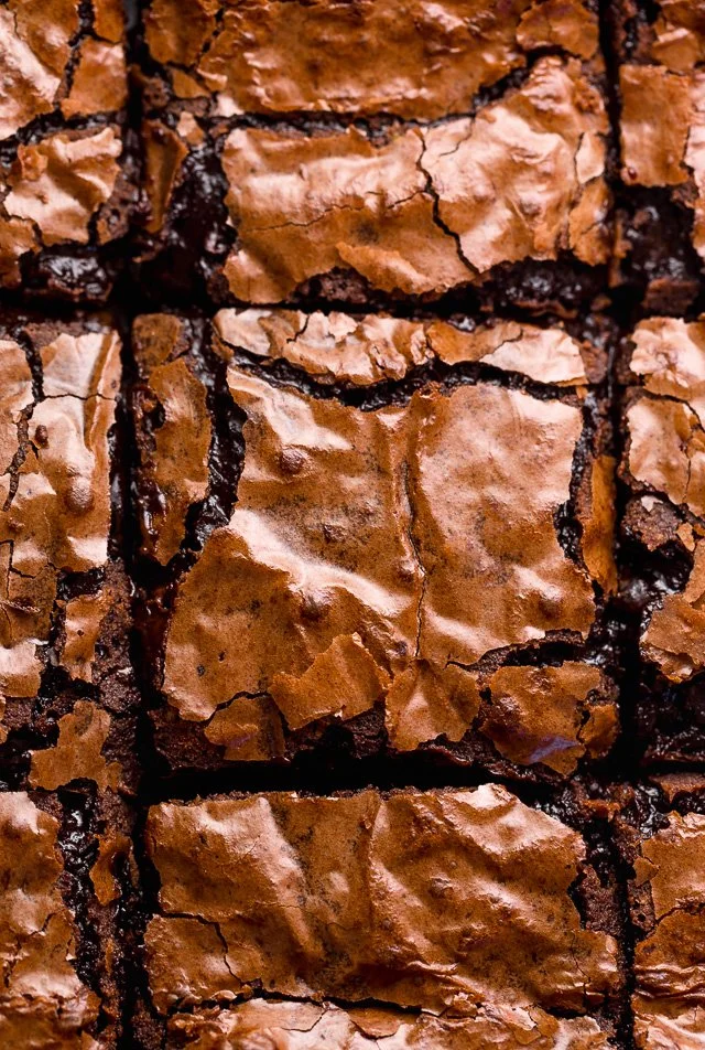 Delicious fudge brownies with shiny, crackly tops fresh out of the oven.