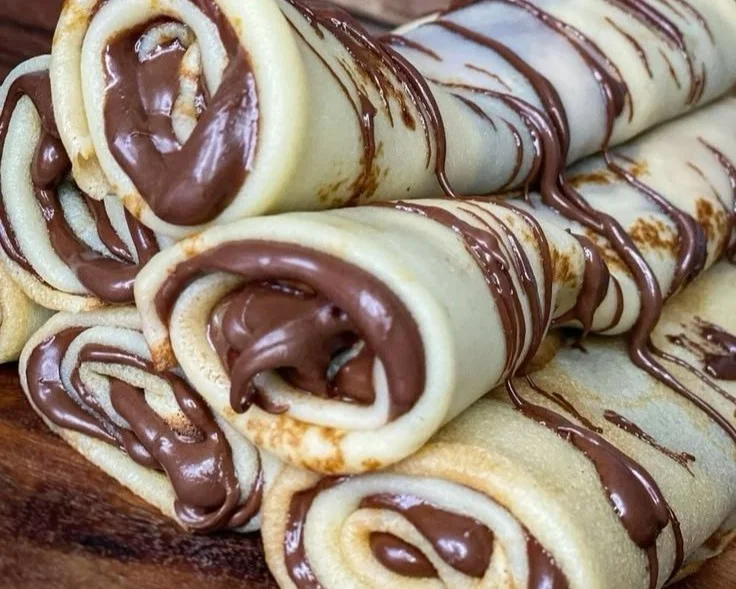 Delicious outdoor cooking setup with picnic table and fresh ingredients.