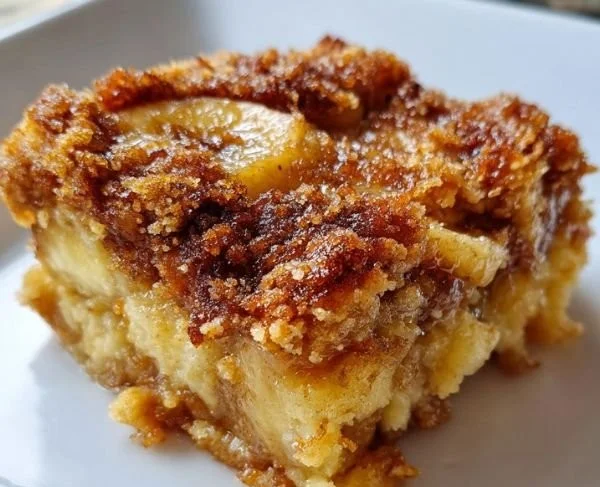 Delicious homemade banana cobbler served warm with a scoop of ice cream