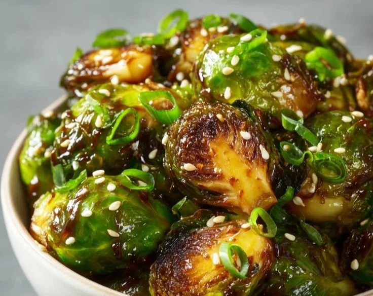 Brussels sprouts with miso-sesame glaze served in a bowl
