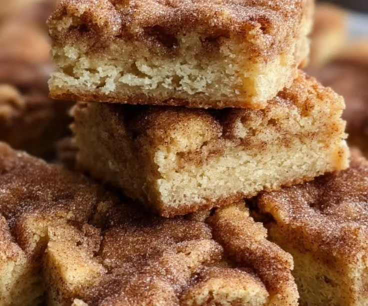 Chewy snickerdoodle cookie bars topped with cinnamon sugar
