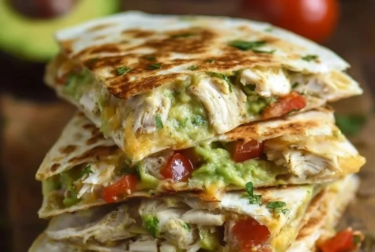 Delicious chicken and avocado quesadillas served on a plate