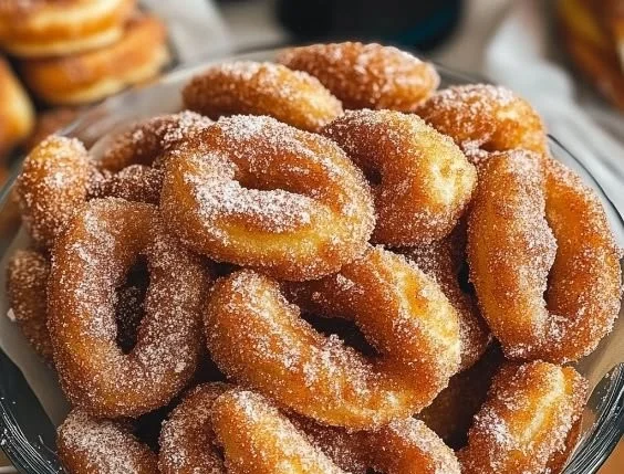 Freshly made Cinnamon Sugar Twist Donuts on a plate