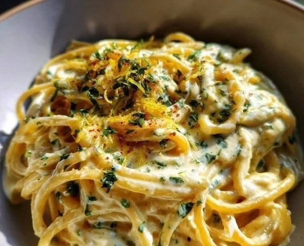 Creamy lemon garlic sauce drizzled over grilled chicken and vegetables