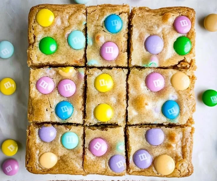 Easter M&M Blondies topped with colorful M&Ms in a delicious blondie base