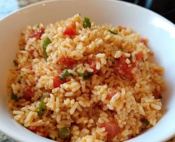 Bowl of easy Rotel Mexican rice topped with fresh cilantro.