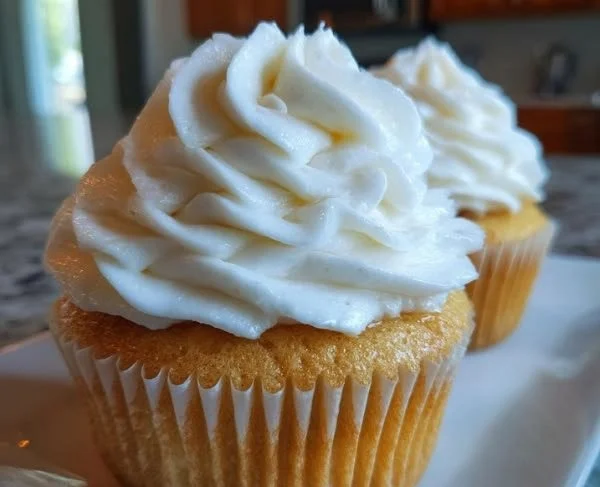 Delicious cake topped with smooth and fluffy ermine frosting