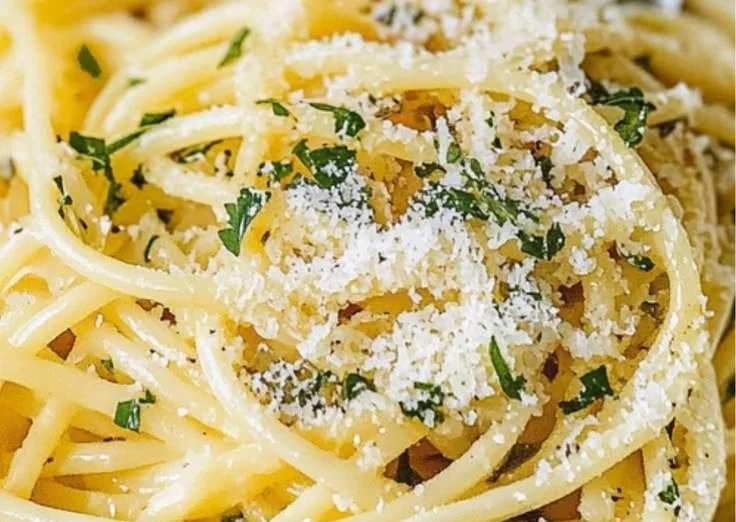 Delicious plate of Lemon Garlic Pasta topped with parsley and lemon zest