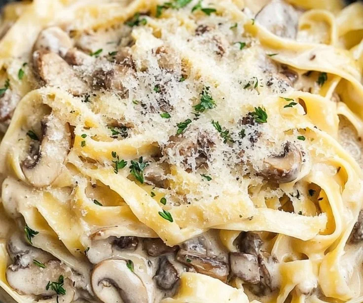 Creamy Mushroom Sauce served over pasta with garnishes