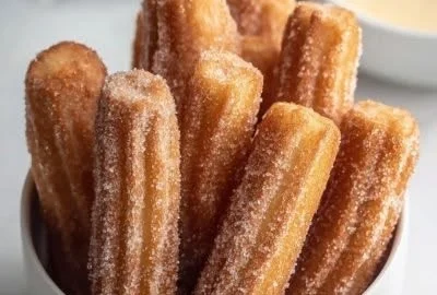 Baked churro bites recipe freshly baked and sprinkled with cinnamon sugar.