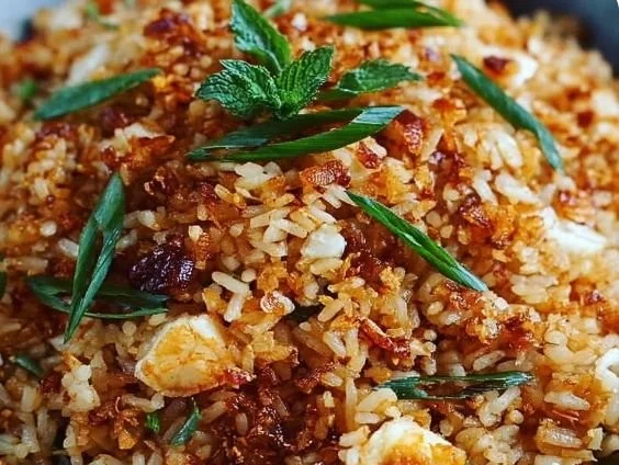 Bobby Flay's crispy rice dish served on a plate, garnished and ready to enjoy.