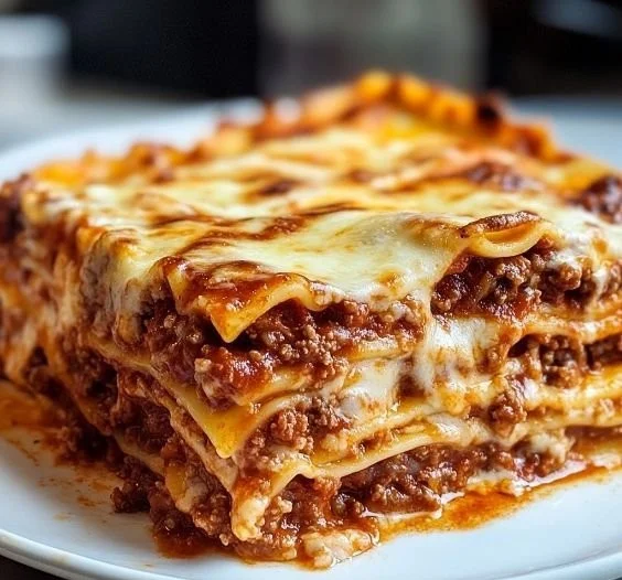 A delicious plate of Bolognese Lasagna layered with rich meat sauce and cheese
