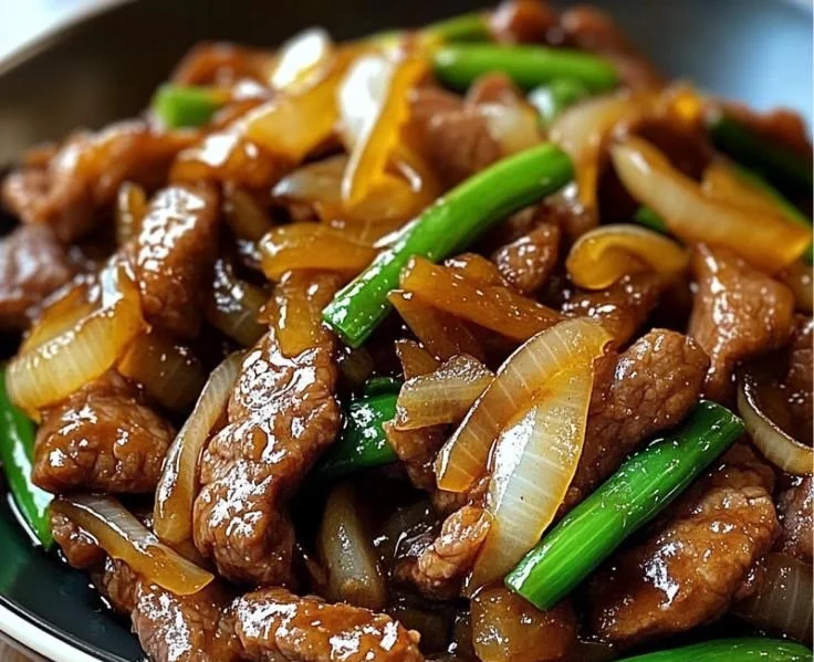 Delicious Chinese Beef Stir-Fry with Caramelized Onions served on a plate