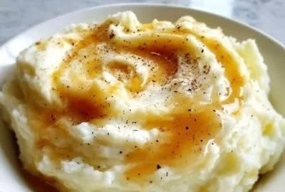 Creamy cauliflower mash in a bowl, served as a healthy side dish