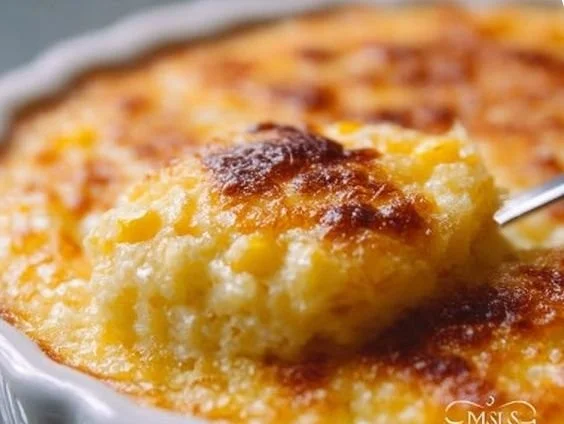 Delicious serving of Grandma's classic corn pudding recipe with golden crust.