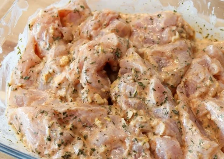 Delicious Greek-style chicken marinade ingredients in a bowl.
