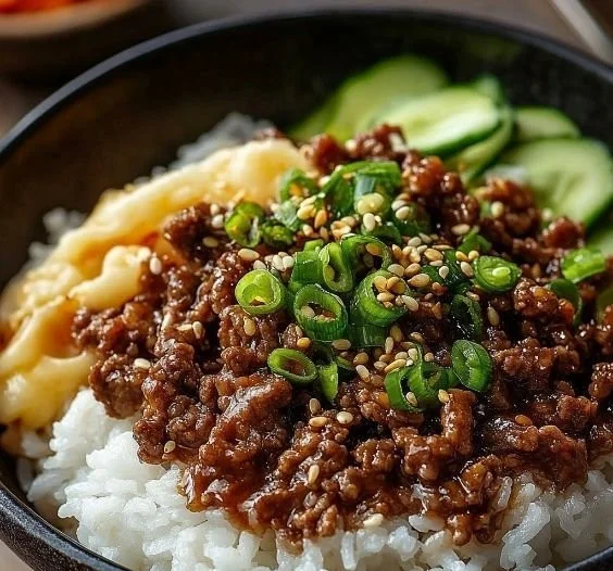 Savory Korean Ground Beef Bowl topped with vegetables and rice