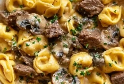 Delicious Philly cheesesteak tortellini plated and garnished.