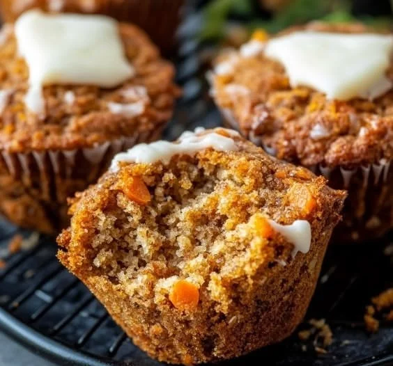Healthy protein-packed carrot lentil muffins displayed on a wooden table.