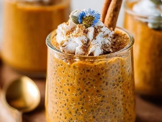Delicious Pumpkin Chia Pudding in a glass topped with pumpkin seeds.