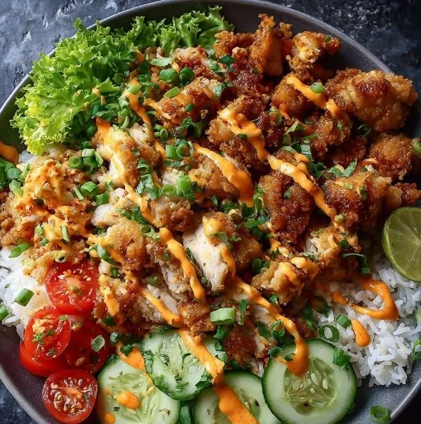 Crispy Chicken Bowl topped with Bang Bang Sauce served in a bowl.