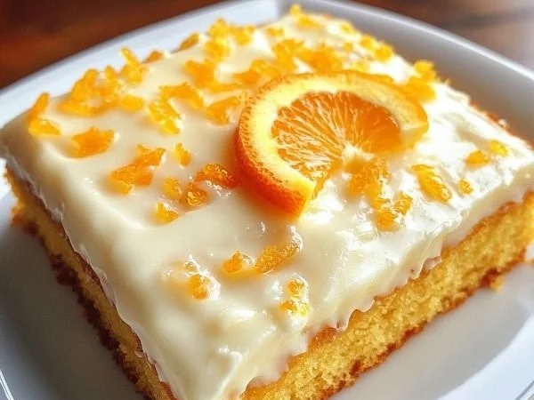 Deliciously moist orange sheet cake topped with fresh orange frosting